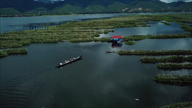 Boat ride towards traditional village on Inle lake