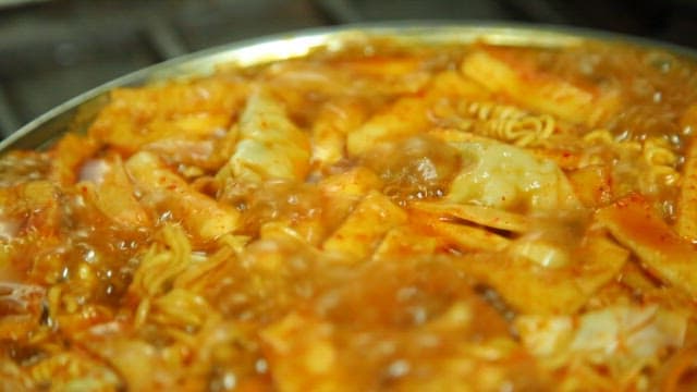 Spicy tteokbokki with ramen boiling in a pot