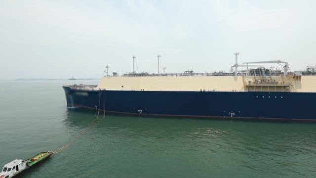 Large cargo ship anchored in a calm sea