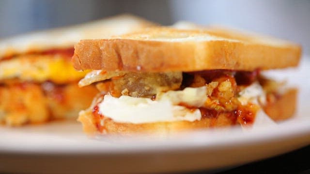 Delicious sandwich with egg and sauce