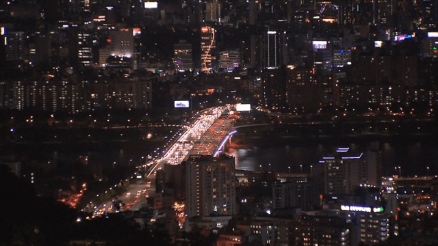 Brightly Lit Night View of a Bustling City
