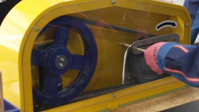Yellow industrial equipment that simulates belt operation