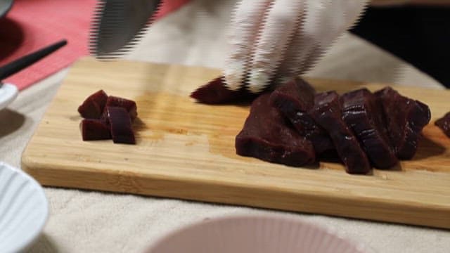 Raw Cow Liver Being Prepared on a Wooden Cutting Board