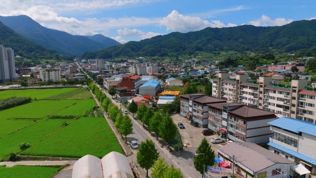 Scenic view of a city with mountains
