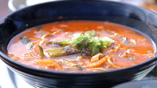 Spicy fish porridge with vegetables and flounder