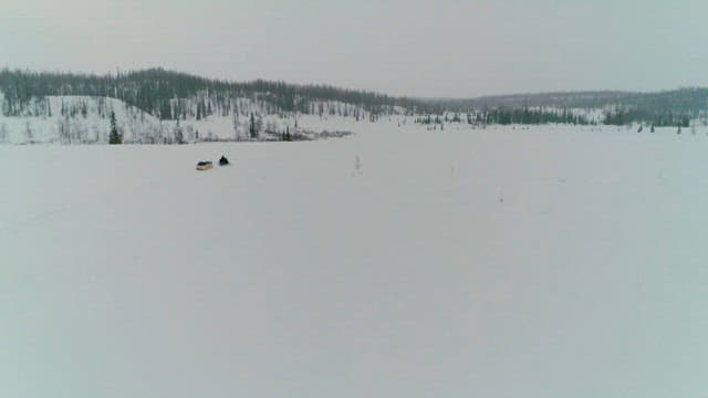 Snowmobile Ride Across a Snowy Landscape