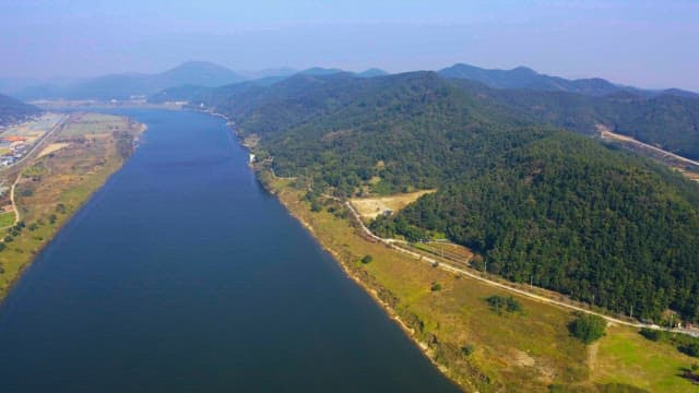 Rivers flowing against the backdrop of green forests and mountains