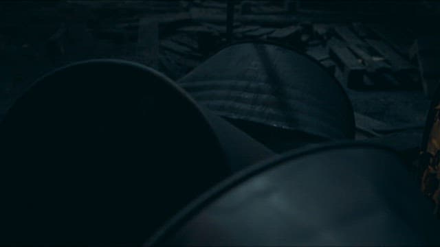 Person Looking Around the Charred Scene of Fire Accident