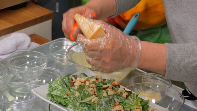 Preparing spring cabbage salad with cheese