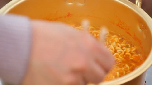 Chopstickful of warm ramen from a pot of sheep