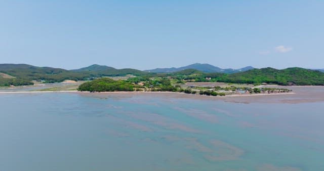 Serene coastal landscape with mountains