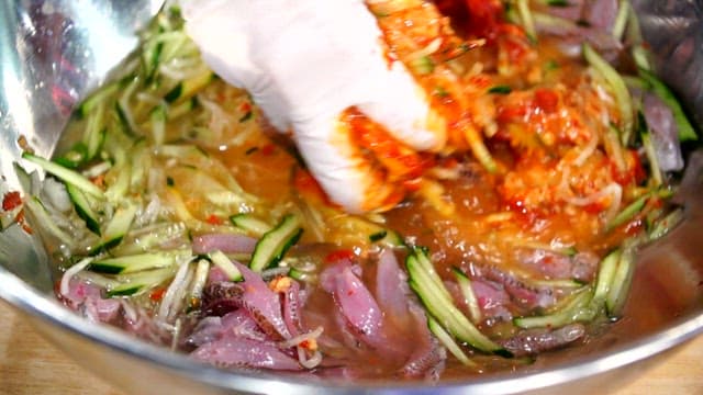 Mixing fresh vegetables and seafood