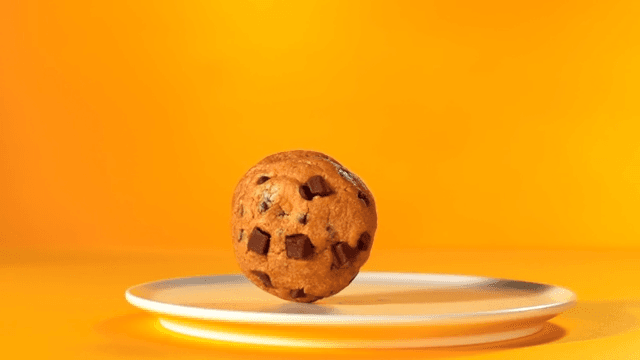 Chocolate chip cookie on a white plate