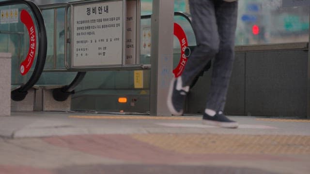 Subway entrance with people passing by