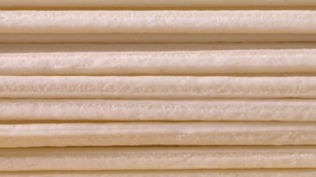 Close-up of stacked white noodles
