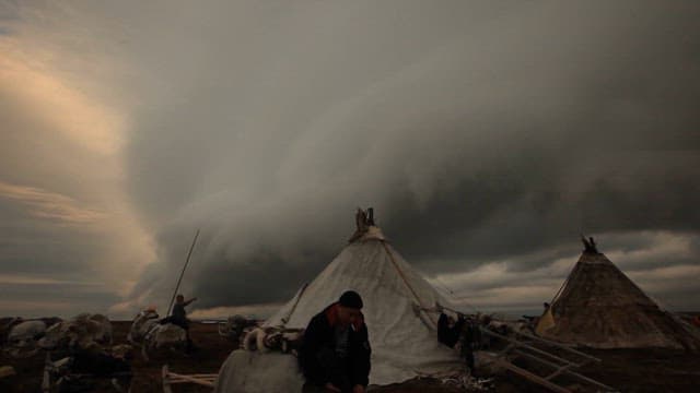 Nomadic Camp Under Ominous Clouds
