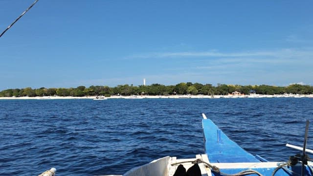 Boat approaching a scenic island