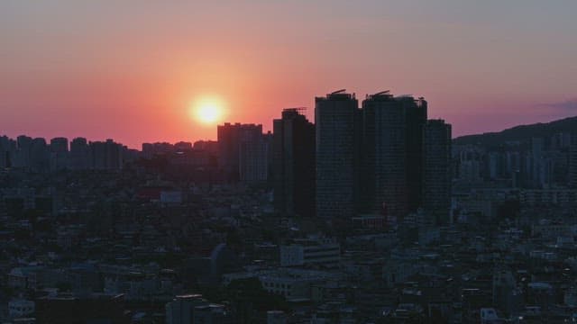 Sunset over a city skyline
