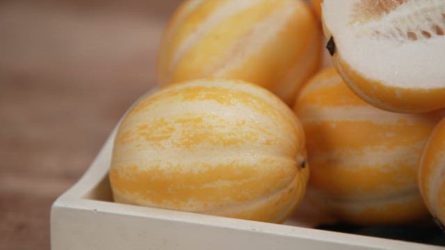 Korean melon Halves in a Wooden Basket