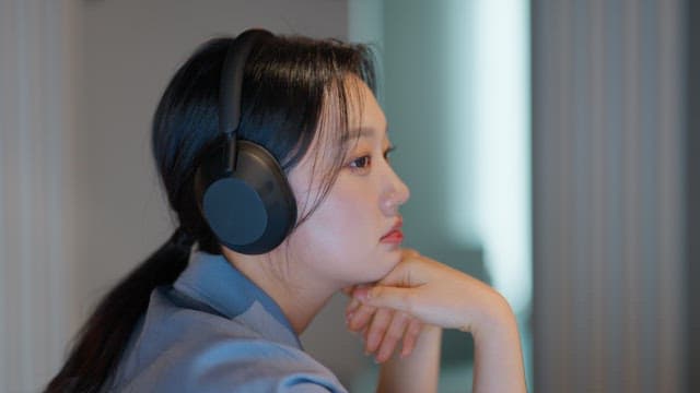 Woman listening to music with headphones