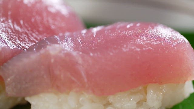 Fresh tuna sushi on a green leaf
