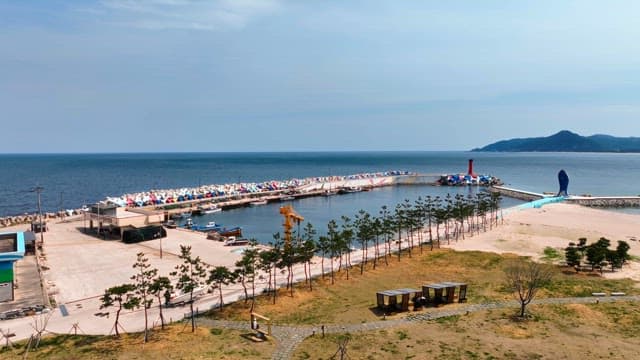 Coastal harbor with colorful breakwaters