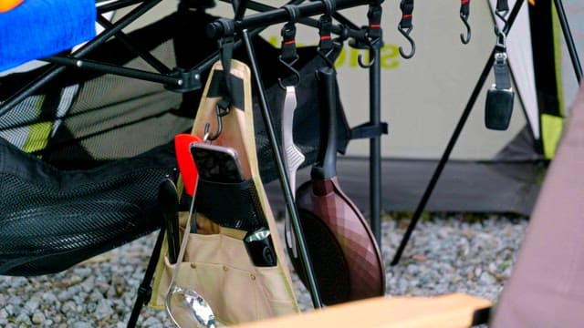 Outdoor camping setup with hanging utensils
