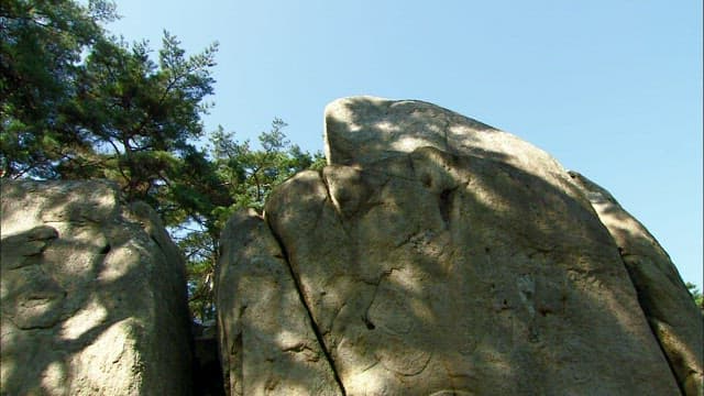 Buddha rock with carved Buddha statue