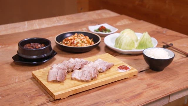 Healthy Korean meal with boiled pork and boiled cabbage