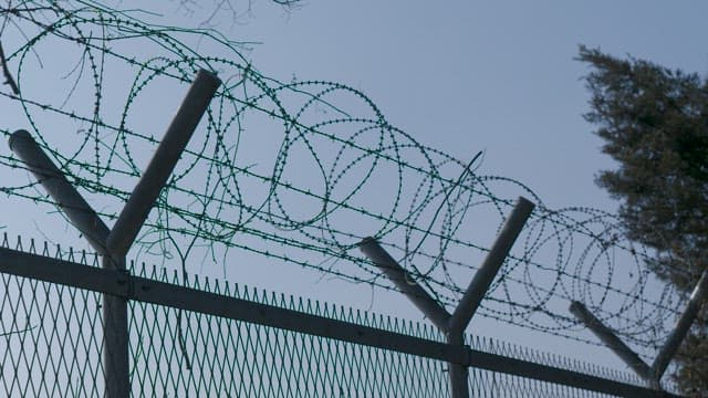 Barbed Wire Fencing Against Sky