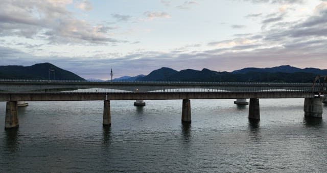 Bridge over a calm river at dusk
