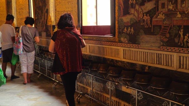 Visitors making offerings in a temple hall
