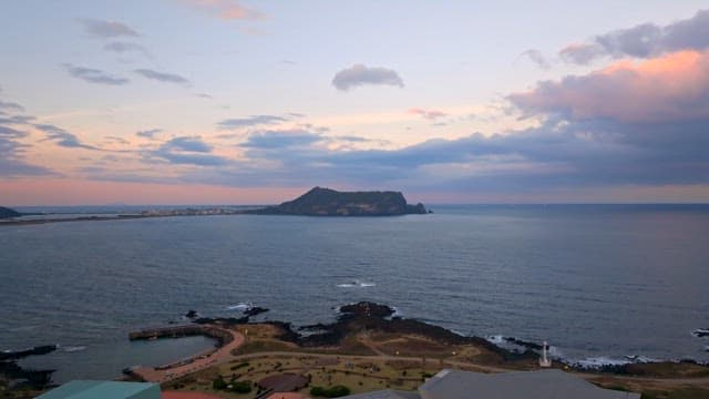 Island view at sunset with calm sea