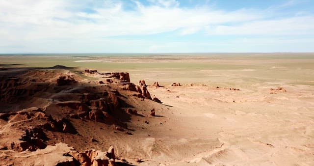 Vast desert landscape with rocky formations