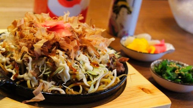 Delicious Yakisoba topped with katsuobushi and vegetables