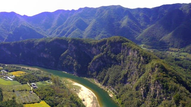 Countryside river bend with lush greenery
