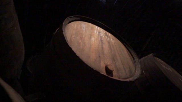 Large Wooden Barrel in a Fdimly Lit Storage Room