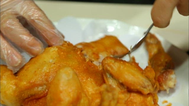 Chicken cut with a fork