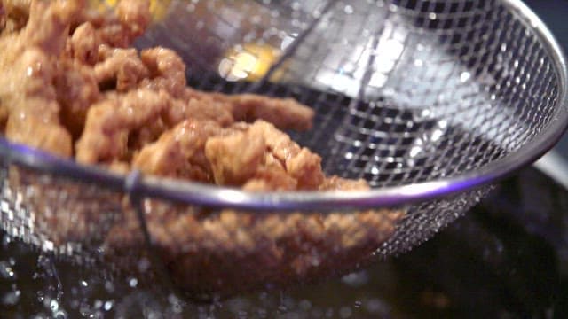 Fried pork taken out of hot oil
