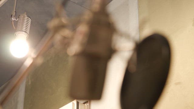 Microphone in a lit recording studio