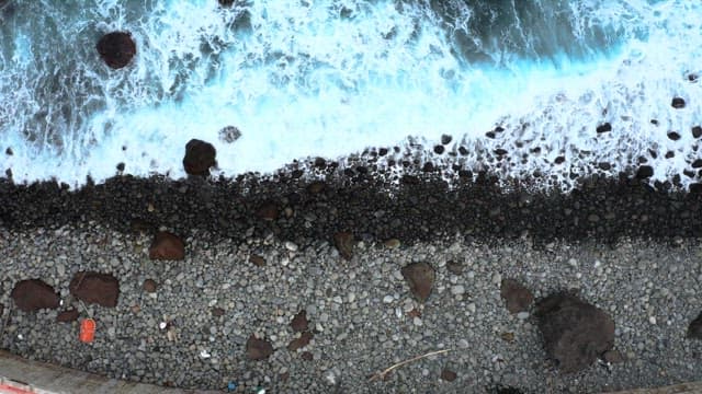 View of waves crashing onto a rocky shore