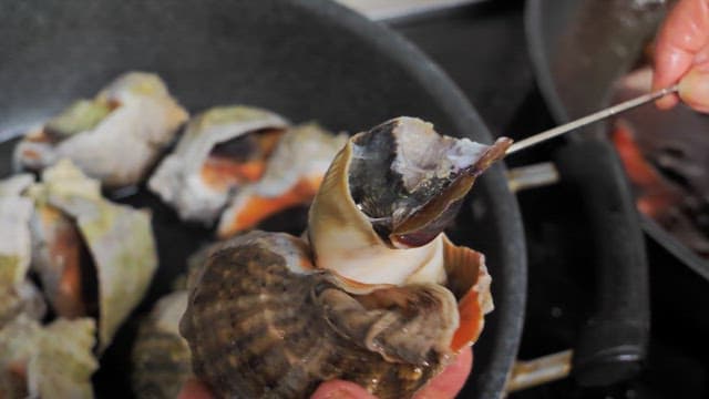 Removing Freshly Boiled Conch with Chopsticks