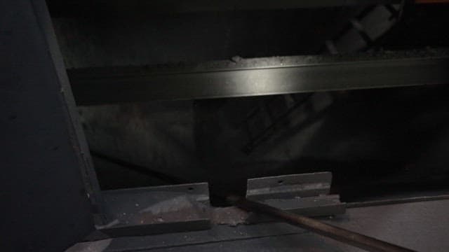 Inside a dark coal mine with black coal dust falling