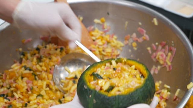 Adding Gratin Ingredients to Hollowed-out Pumpkin