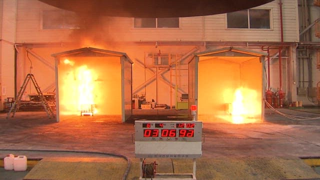 Fire test at an industrial facility with safety equipment