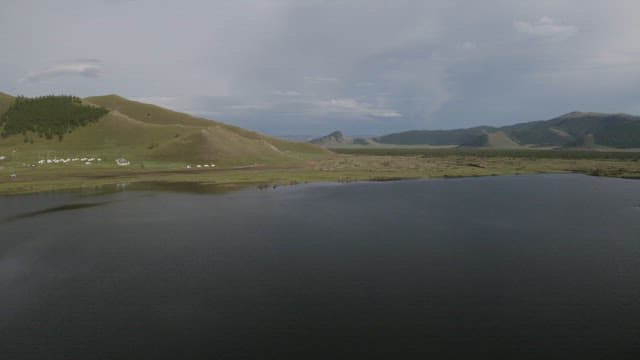 Tranquil Lakeside View with Nomadic Settlement