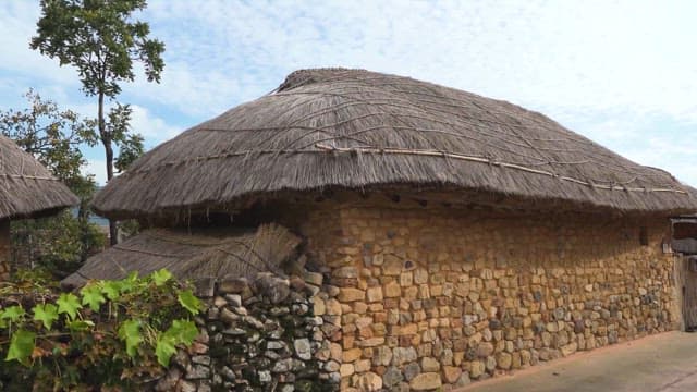 Traditional Stone Fences and Thatched Roof Houses