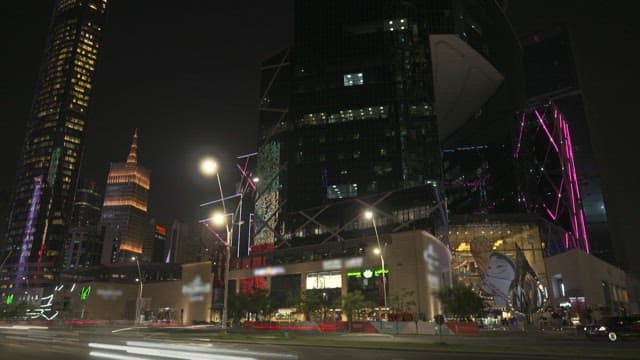 Bustling City Night with Glowing Skyscrapers