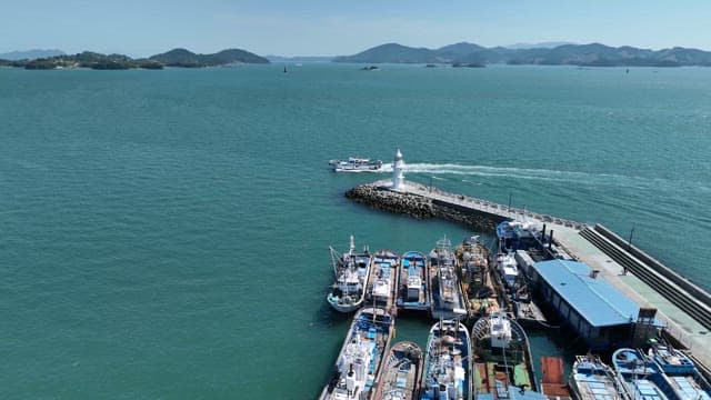 Boat sailing near a lighthouse