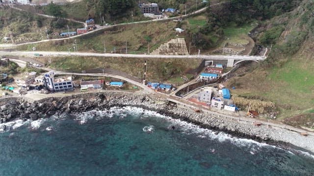 Coastal Village by Rocky Shoreline